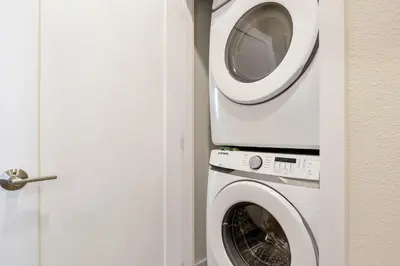 a washing machine and a washer in a room at 3 bedrooms pool home Hidden Forest Resort Amenities in Orlando