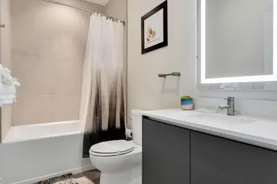 a bathroom with a toilet and a sink and a shower at 3 bedrooms pool home Hidden Forest Resort Amenities in Orlando