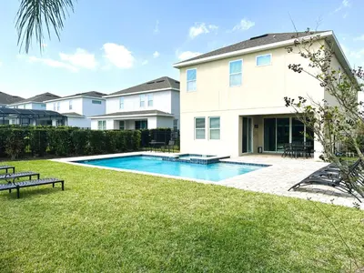 a house with a swimming pool in the yard at 6 bedrooms pool home Encore Reunion Resort Gated in Orlando