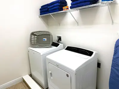 a laundry room with a washer and dryer at 6 bedrooms pool home Encore Reunion Resort Gated in Orlando