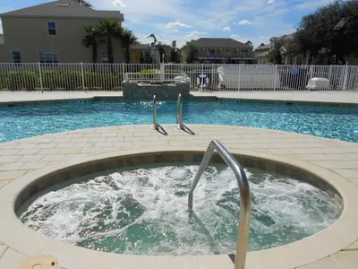 a hot tub in the middle of a swimming pool at 3 bedrooms pool home Hidden Forest Resort Amenities in Orlando