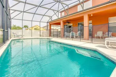 a swimming pool in the middle of a house at S890SB - 12 guests - 6 beds in Kissimmee