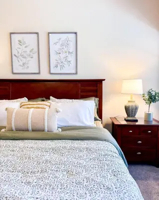 a bedroom with a bed and a table with a lamp at WH7783TB-Windsor Hills- 10 guests - in Orlando