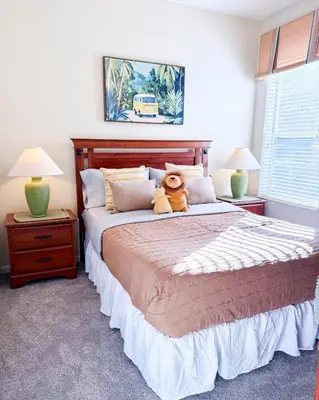 a teddy bear sitting on a bed in a bedroom at WH7783TB-Windsor Hills- 10 guests - in Orlando