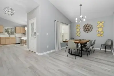 a dining room and kitchen with a table and chairs at IC8090ICB - Indian Creek Oasis in Kissimmee