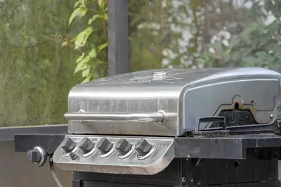 a grill with a toaster on top of it at Lakeview Family Haven in Kissimmee - Pool & Scenic Views in Kissimmee