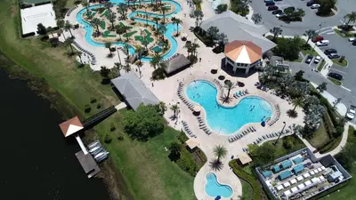 an overhead view of a pool at a resort at Wonderful home close to disney & universal in Kissimmee