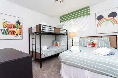 a bedroom with two beds and a bunk bed at Spacious & Comfy Retreat Prime Location Amazing in Kissimmee