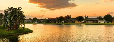 a large body of water with houses in the background at Princess Hideaway in Orlando