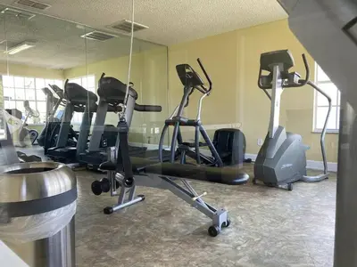 a gym with several exercise bikes in a room at Cozivill in Kissimmee