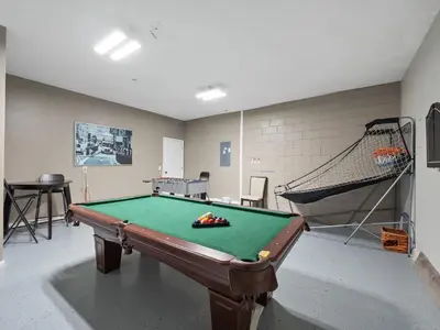 a room with a pool table and a net at bsv_villa2633 in Kissimmee