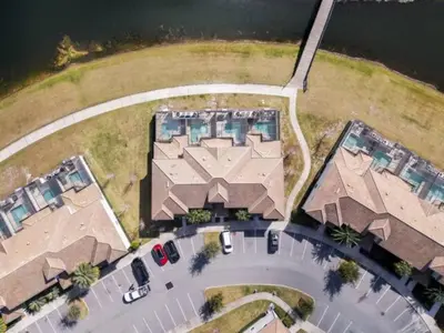 an overhead view of a large house with a parking lot at Charming 4BR with Private Heated Pool & BBQ Grill in Kissimmee