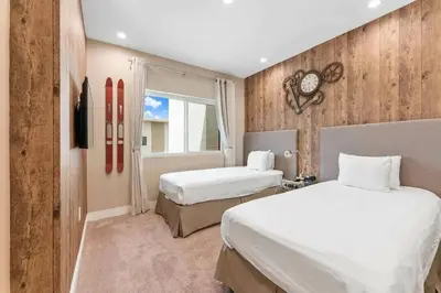 a hotel room with two beds and a window at Elegant Home w 3 En Suites & Breathtaking View in Orlando