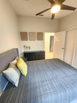 a bedroom with a bed with two pillows on it at The Villa Orlando College Park Sleeps16 - Monthly Stays in Orlando