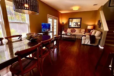 a living room with a table and a couch at ABC Vacation Homes in Kissimmee