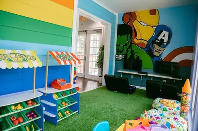 a childs room with a superhero themed bedroom at ABC Vacation Homes in Kissimmee