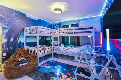 a bedroom with two bunk beds and a pool at Family Retreat near Disney with Pool & Hot Tub! in Kissimmee