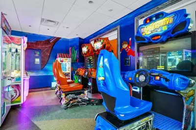 a childs room with a video game arcade at Lively Home Near Disney With Private Pool, Game And Themed Rooms With Waterpark & Resort Access At Encore Resorts Reunion - 670La in Kissimmee