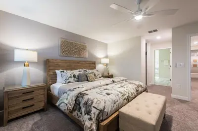 a bedroom with a bed and a ceiling fan at Chic Luxury Haven - Unforgettable Retreat in Kissimmee