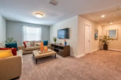 a living room with a couch and a table at Stunning Home Private Pool Great Location in Kissimmee