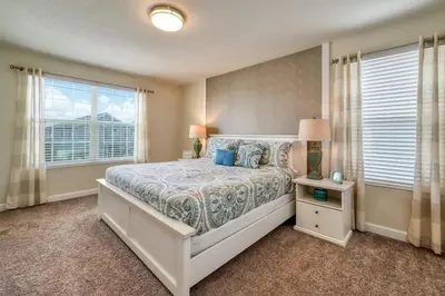a bedroom with a large bed and a window at Stunning Home Private Pool Great Location in Kissimmee