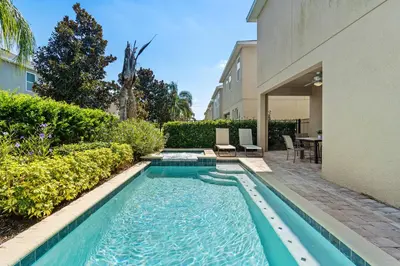 a swimming pool in the backyard of a house at 8 Bd home with Themed rooms and Pool 2308 in Orlando
