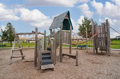 a playground with a slide in a park at Storey Lake: Apartment with lake view in Kissimmee