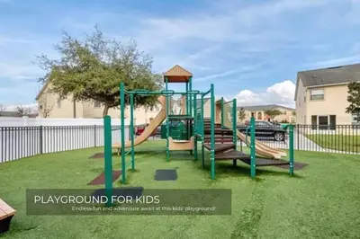 a playground for kids with a slide at Stunning 3BD Condo 14 Mins to Disney World , Gated in Kissimmee