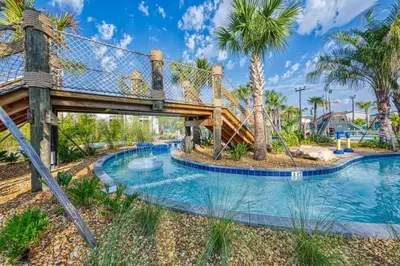a water park with a slide and a playground at Vibrant Themed Home Prime Location in Kissimmee