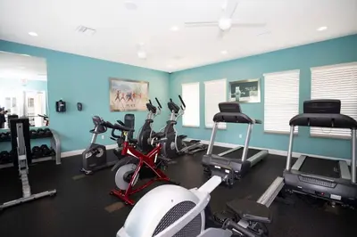 a gym with several exercise bikes in a room at Modern Luxury Retreat - Mickey & Harry Potter Beds in Orlando