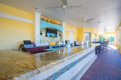a bar in a restaurant with a counter top at Leisure & Business Oasis-Near Convention Center in Orlando