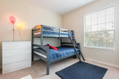 a bedroom with two bunk beds and a balloon at Central Elegance-Spacious Beautifully Decor Condo in Orlando