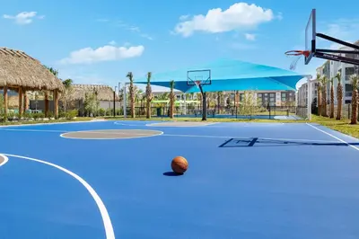 a basketball hoop with a basketball on the court at Villatel Orlando Resort in Orlando