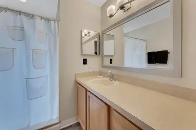 a bathroom with a sink and a mirror at Gorgeous Place Minutes Away from Attractions in Kissimmee