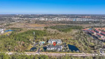 an aerial view of a large house in a city at The Secret Rose Apartment - Modern & Stylish - 8 Mins from Disney in Kissimmee