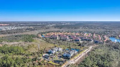 an aerial view of a city with houses and a river at The Secret Rose Apartment - Modern & Stylish - 8 Mins from Disney in Kissimmee