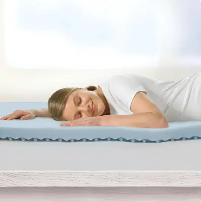 a woman laying on a mattress at DisneyResortVillas by AmericanVacationLiving 1 BR in Orlando