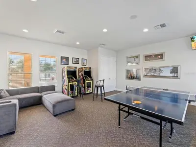 a living room with a ping pong table in it at Priceless Peace at Serenity by Shine Villas, 081 townhouse in Orlando