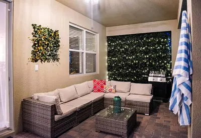 a living room with a couch and a table at Luxury and Fun near DISNEY PARKS 9BR in Kissimmee