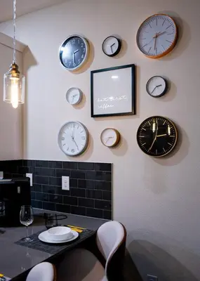 a bunch of clocks on the wall in a restaurant at Luxury and Fun near DISNEY PARKS 9BR in Kissimmee