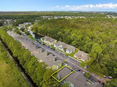 an aerial view of a parking lot with cars at DONOT BOOK thakn you in Kissimmee