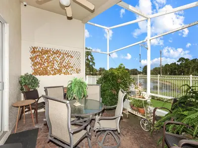 a patio with a glass table and chairs at No place like home in Oviedo