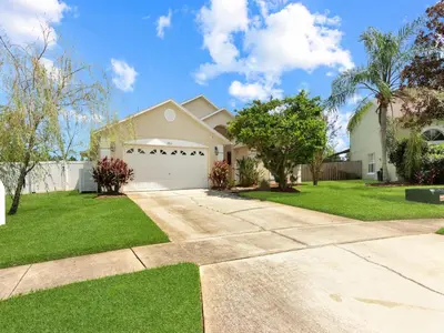 a house with a driveway and a garage at No place like home in Oviedo