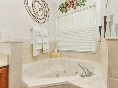 a white bath tub in a bathroom with a window at No place like home in Oviedo