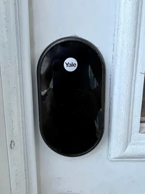 a black door with a white sticker on it at Beautiful Bungalow in Orlando