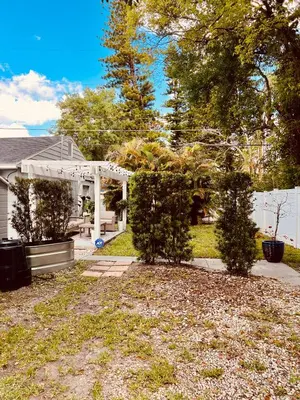 a house with a white gazebo and trees at Beautiful Bungalow in Orlando