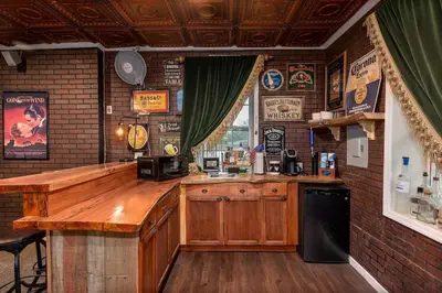 a bar with a wooden counter in a restaurant at 4,800 sf Estate Pool Lake Weddings and Events in Orlando
