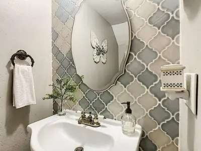 a bathroom with a sink and a mirror at 4,800 sf Estate Pool Lake Weddings and Events in Orlando