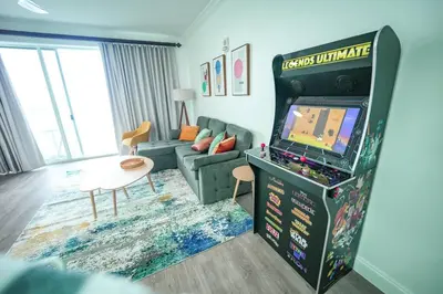 a living room with a video game in a living room at ORLANDO - BLUE HERON Great Apt - 7 pax in Orlando