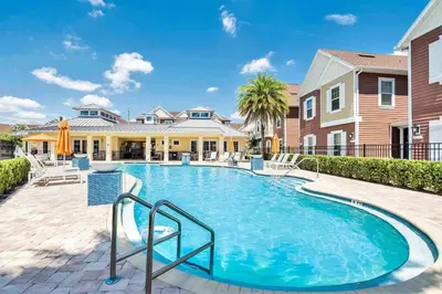 a swimming pool in front of a house at NEW awesome dream house, 5 Min to Disney in Orlando